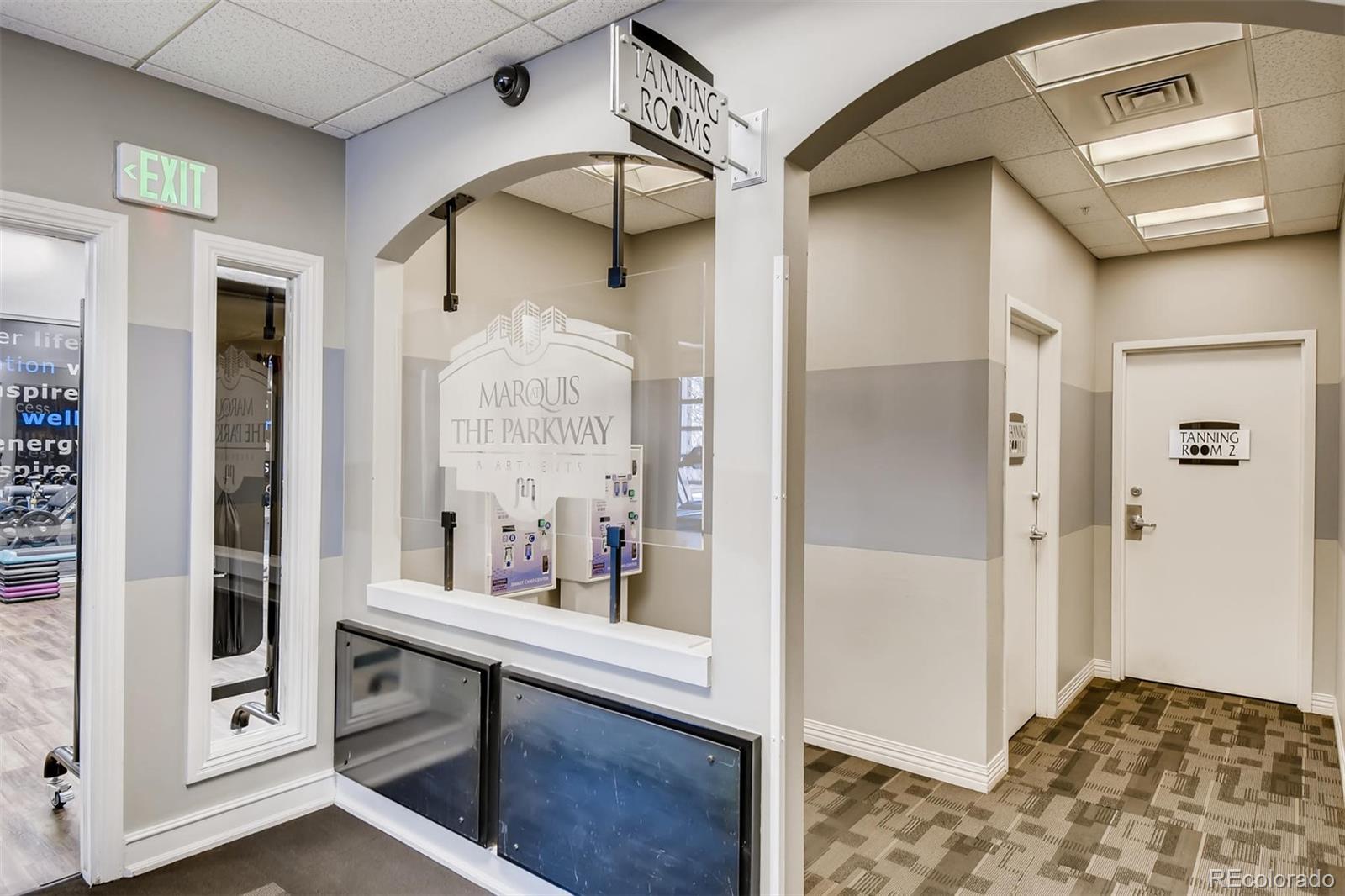 1301 Speer Boulevard, Unit 403 Denver, CO 80204 - Photo 14 of 26 a bedroom with a bed and a mirror