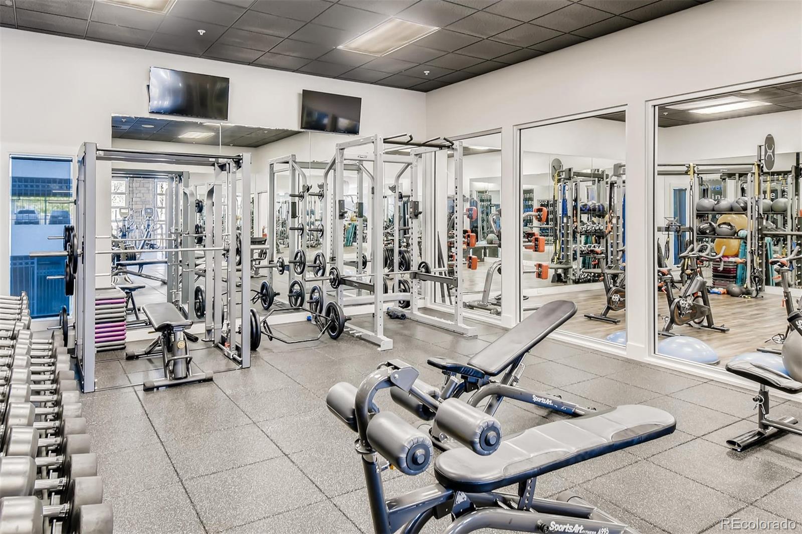 1301 Speer Boulevard, Unit 403 Denver, CO 80204 - Photo 16 of 26 a view of a livingroom with furniture and a table
