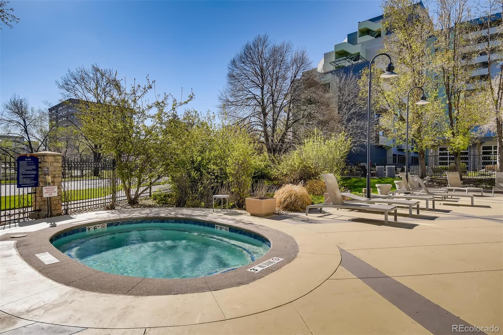 1301 Speer Boulevard, Unit 403 Denver, CO 80204 - Photo 20 of 26 a view of a swimming pool with outdoor seating