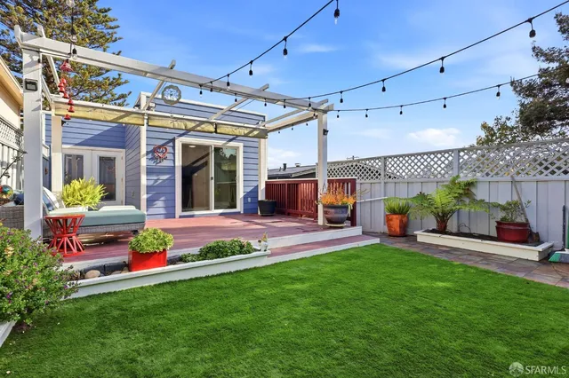 a view of a house with a yard porch and sitting area