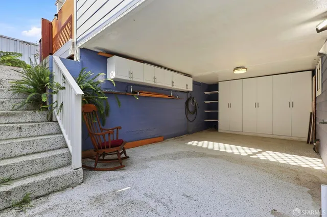 a view of a backyard with sitting area