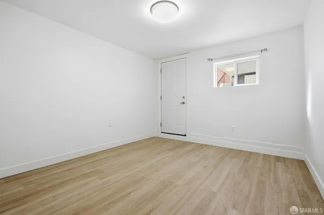 a bathroom with a toilet sink and shower
