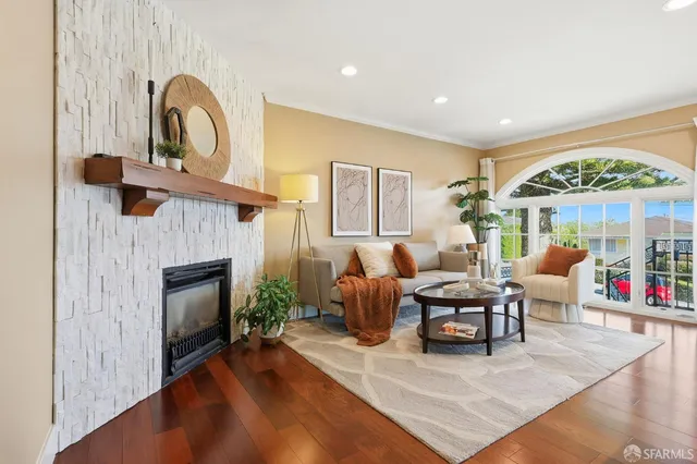 a living room with furniture and a fireplace
