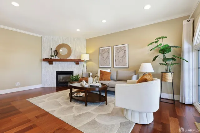 a living room with furniture and a fireplace