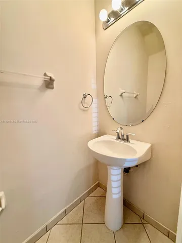 a bathroom with a sink a mirror and a toilet