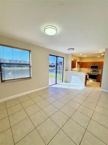 a kitchen with stainless steel appliances a stove a sink a microwave and a refrigerator