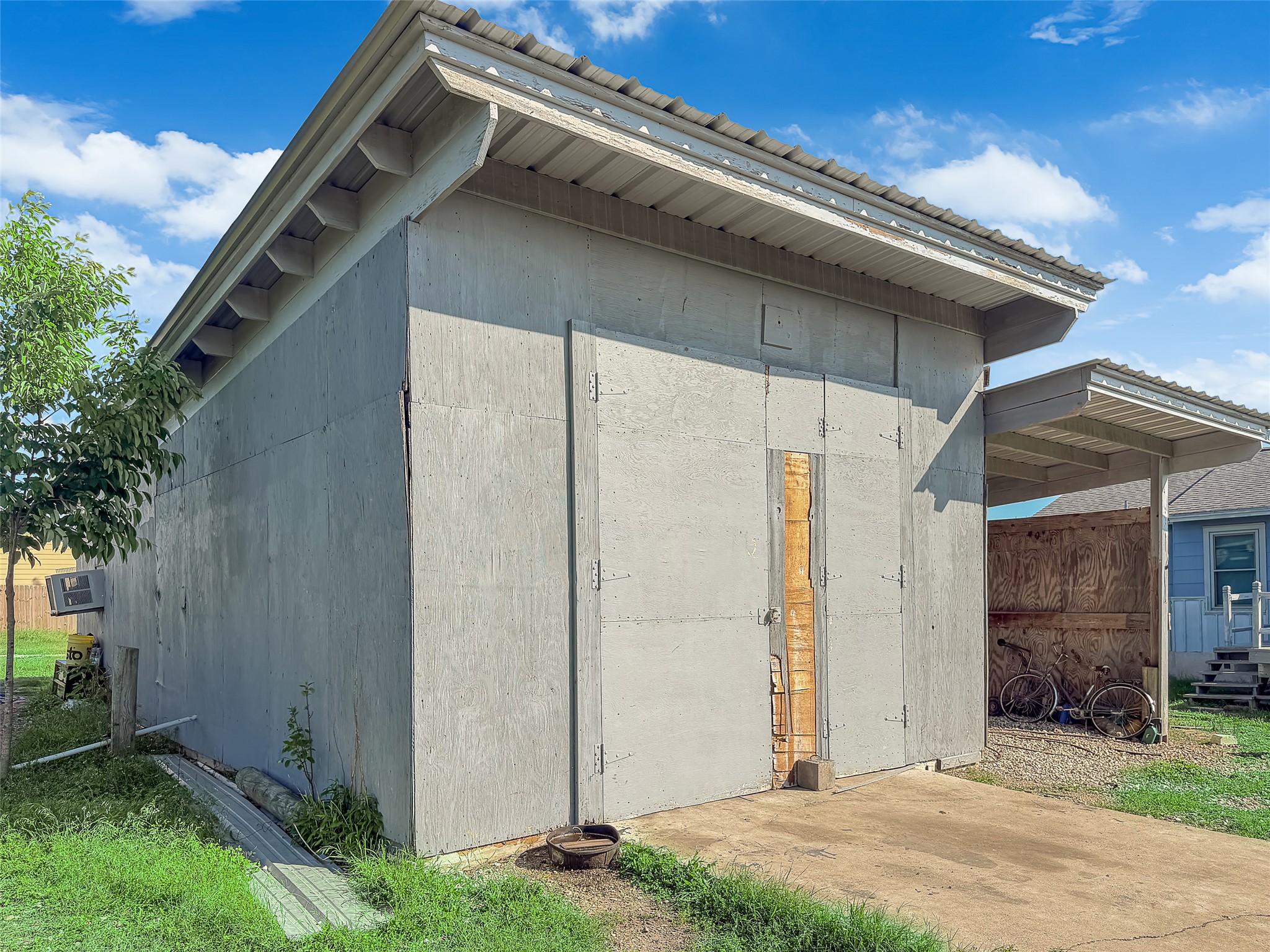 925 Long Hollow Road Dale, TX 78616 - Photo 21 of 26 Freestanding outbuilding with concrete slab construction and a corrugated roof