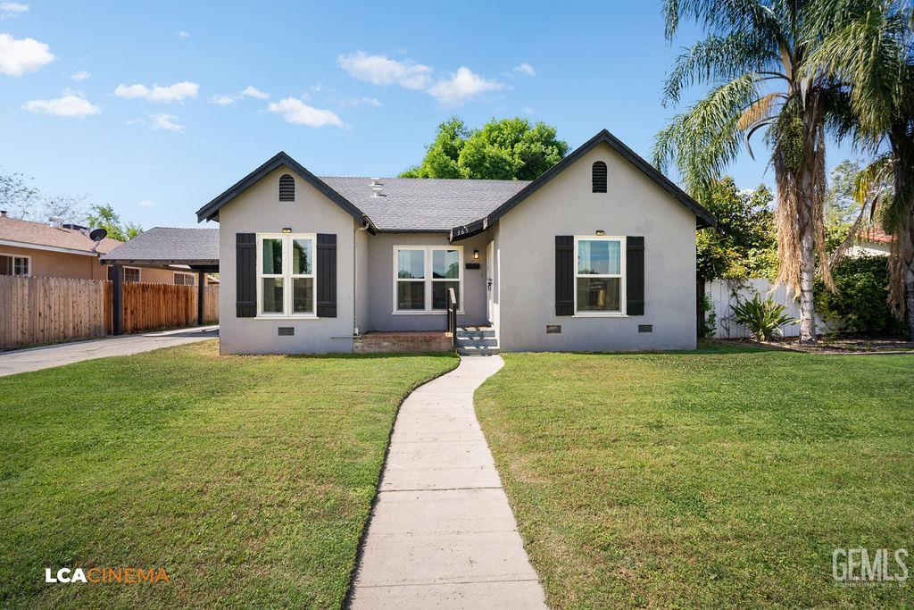 Undisclosed Address Shafter, CA 93263 - Photo 1 of 21 a front view of house with yard and green space