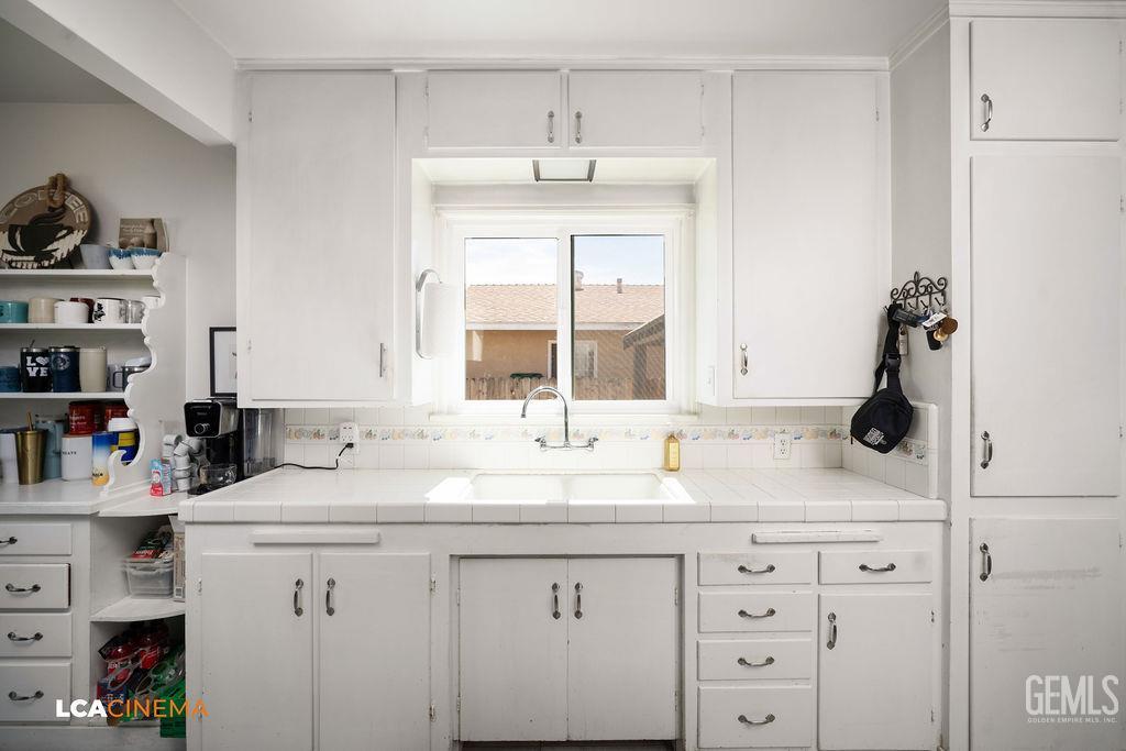 Undisclosed Address Shafter, CA 93263 - Photo 12 of 21 a bathroom with a sink and a window