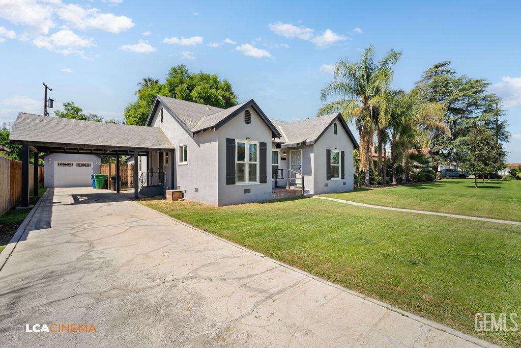 Undisclosed Address Shafter, CA 93263 - Photo 3 of 21 a front view of a house with a garden