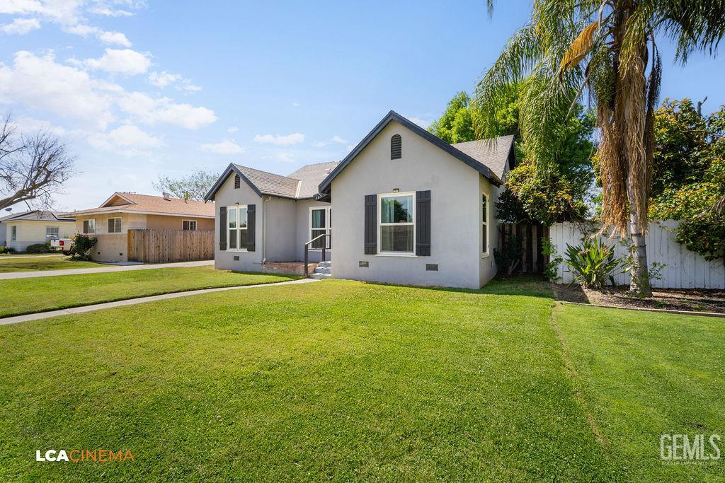 Undisclosed Address Shafter, CA 93263 - Photo 4 of 21 a view of a house with a big yard and palm trees