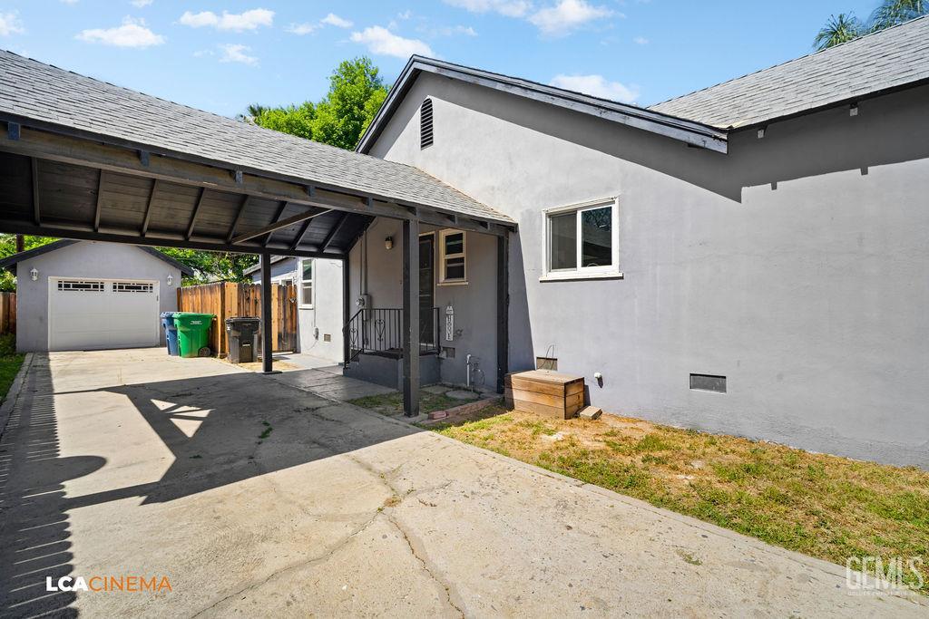 Undisclosed Address Shafter, CA 93263 - Photo 5 of 21 a front view of a house with a yard and garage
