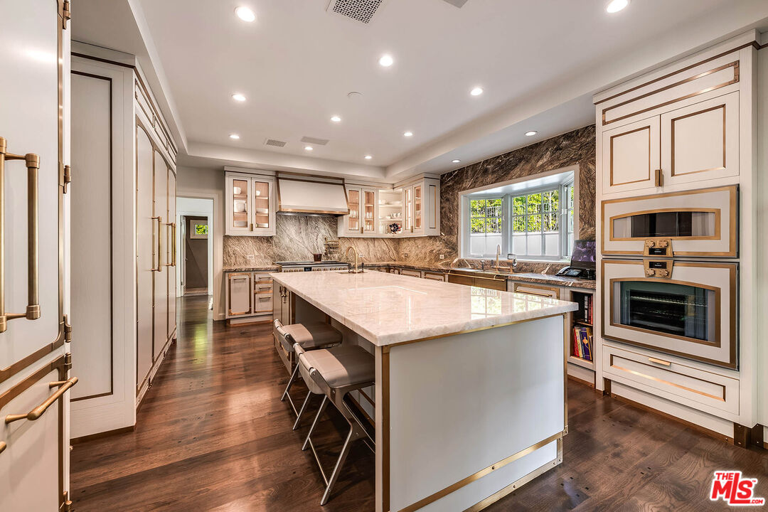 9551 Lime Orchard Road Beverly Hills, CA 90210 - Photo 15 of 27 a kitchen with a sink appliances and cabinets