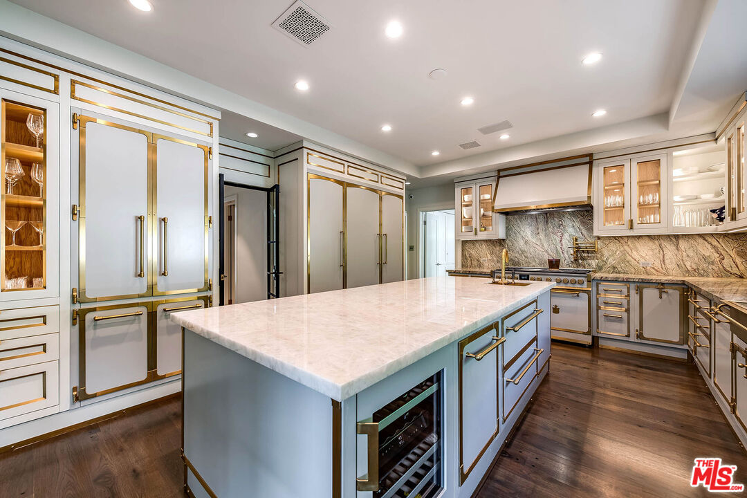 9551 Lime Orchard Road Beverly Hills, CA 90210 - Photo 16 of 27 a kitchen with a stove sink and refrigerator
