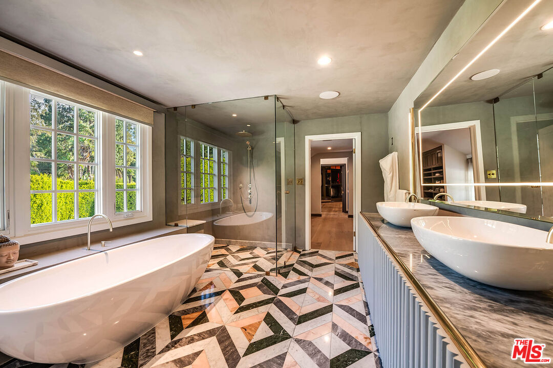 9551 Lime Orchard Road Beverly Hills, CA 90210 - Photo 20 of 27 a large spacious bathroom with a large tub and sink