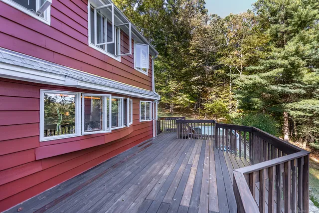 a view of deck with patio and wooden floor
