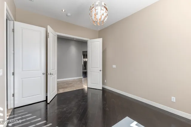 a view of an empty room with a fireplace and a window