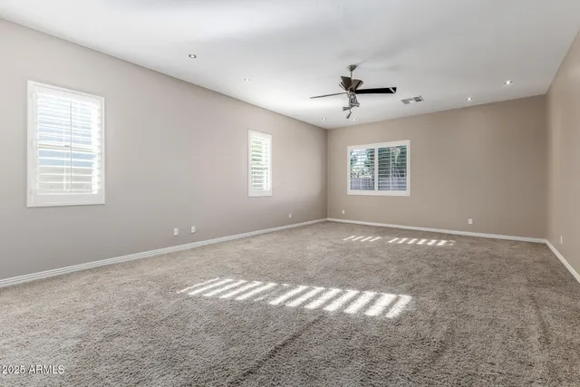 a view of empty room with windows