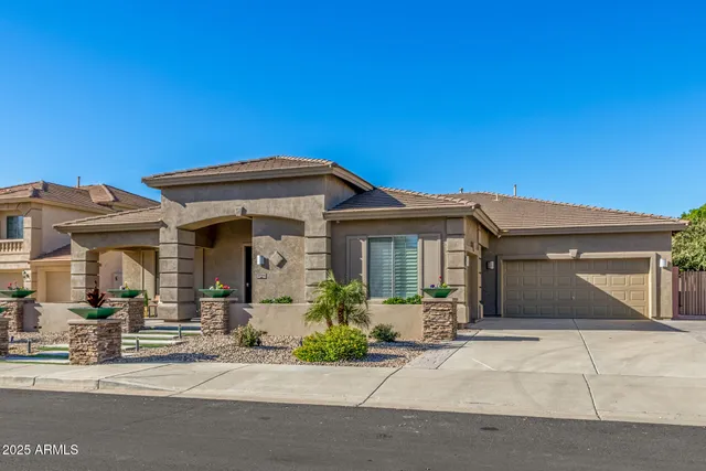 front view of a house with a bench