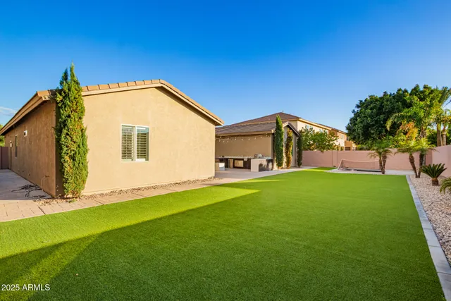 a room with pool table and chairs in it