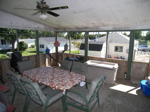860 Walnut Road LaSalle, IL 61301 - Photo 5 of 8 a view of a patio with a dining table and chairs with wooden floor