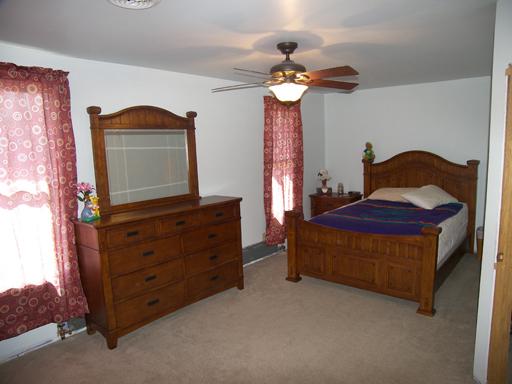 860 Walnut Road LaSalle, IL 61301 - Photo 7 of 8 a bedroom with a bed and a dresser