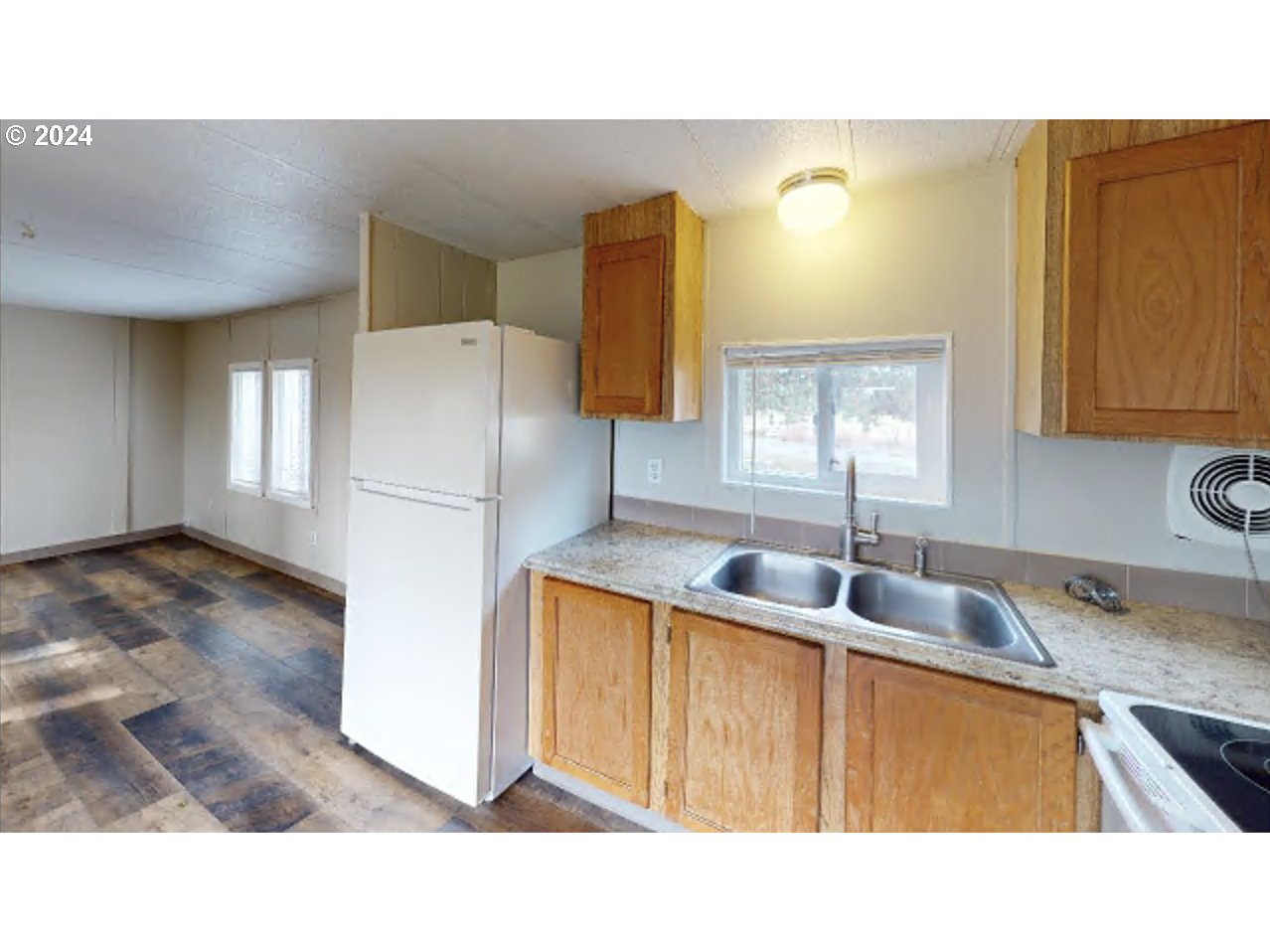 80978 Division Road Irrigon, OR 97844 - Photo 3 of 7 a kitchen with a sink a refrigerator and wooden floor
