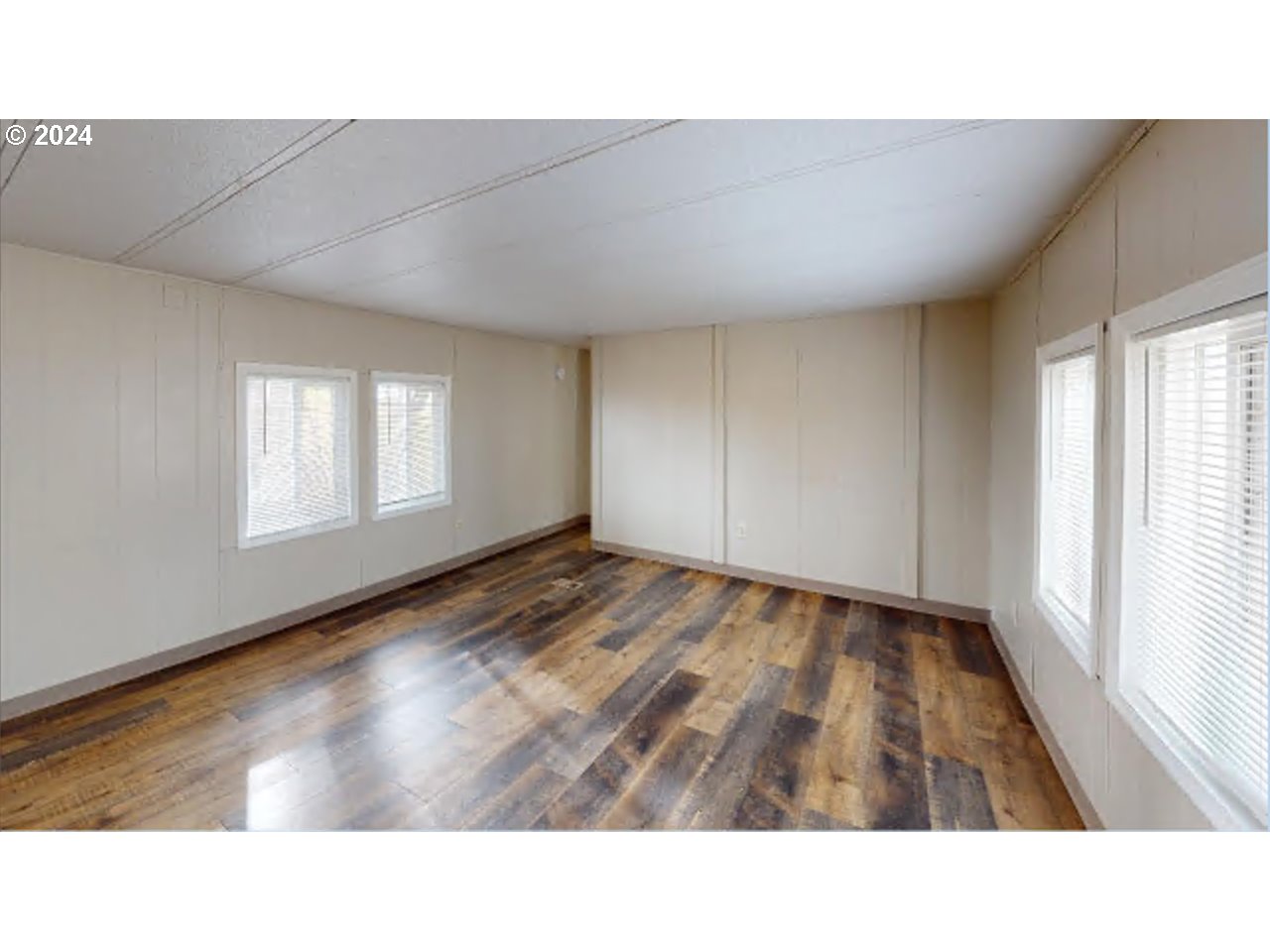 80978 Division Road Irrigon, OR 97844 - Photo 4 of 7 a open hall with wooden floor