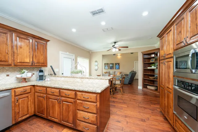 a kitchen with lots of counter top space and appliances