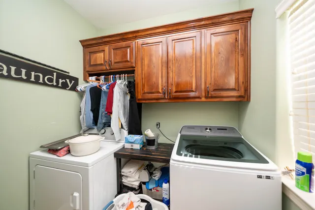 a utility room with dryer and washer