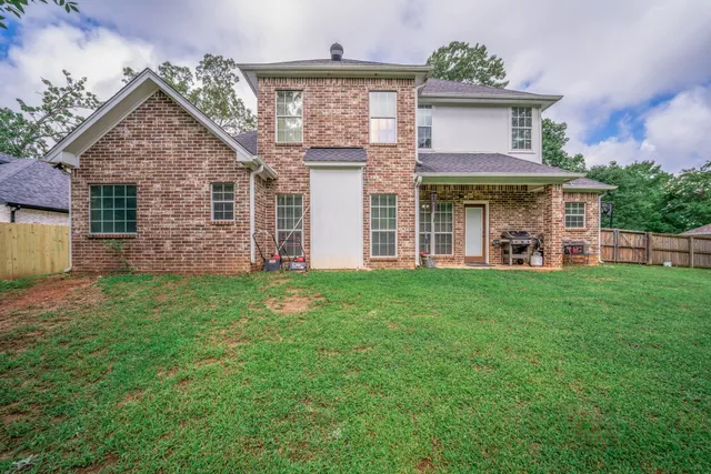 front view of a house with a yard
