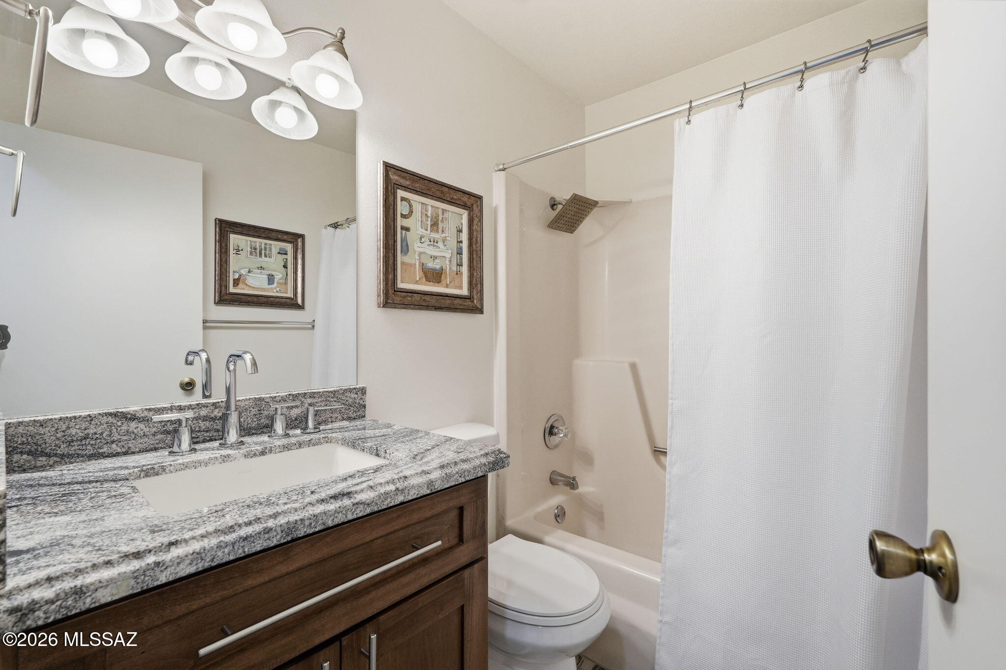 1183 Circulo Canario Rio Rico, AZ 85648 - Photo 21 of 31 a bathroom with a granite countertop sink toilet and shower