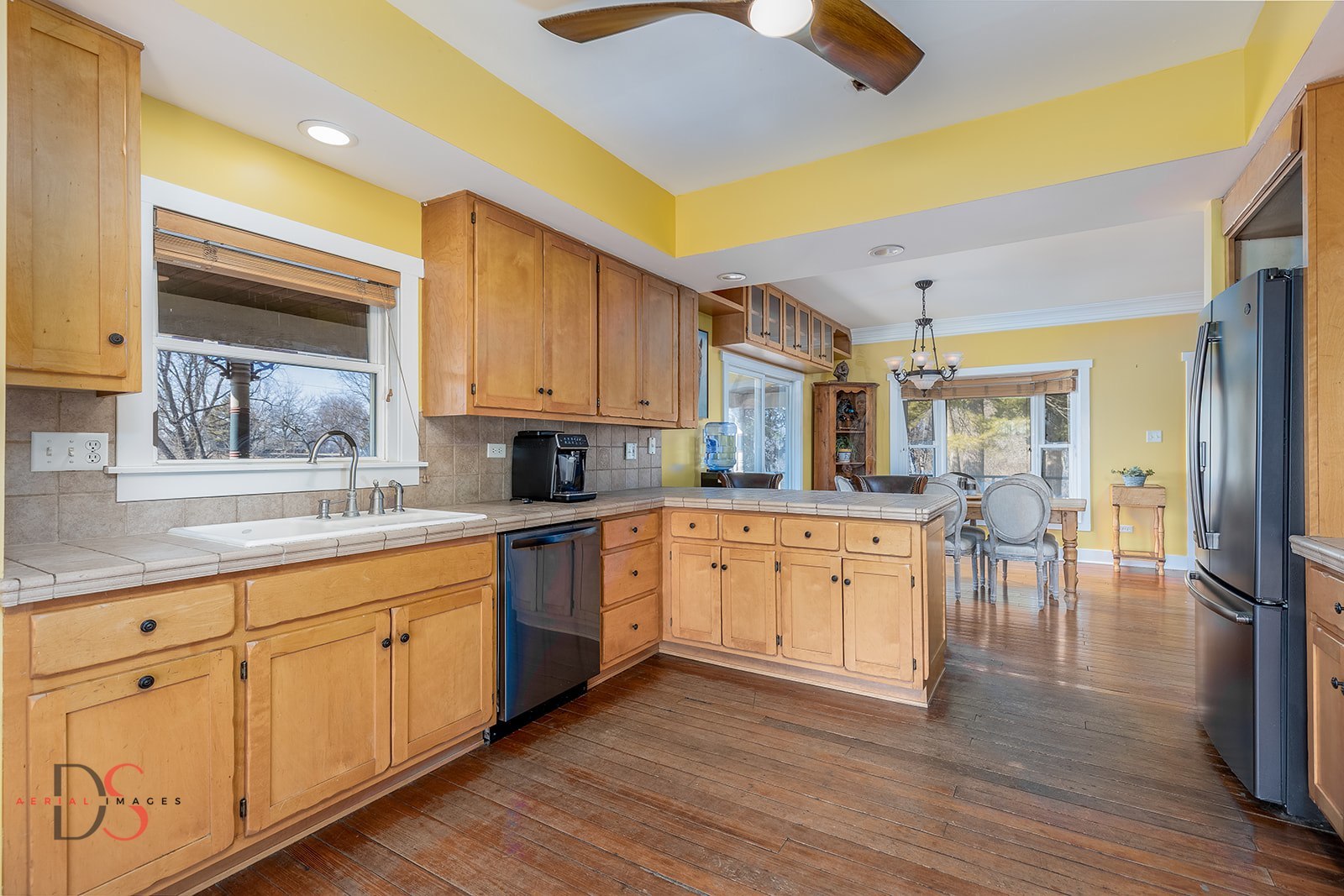 10978 A Crimmin Road Newark, IL 60541 - Photo 11 of 24 a large kitchen with cabinets and wooden floor