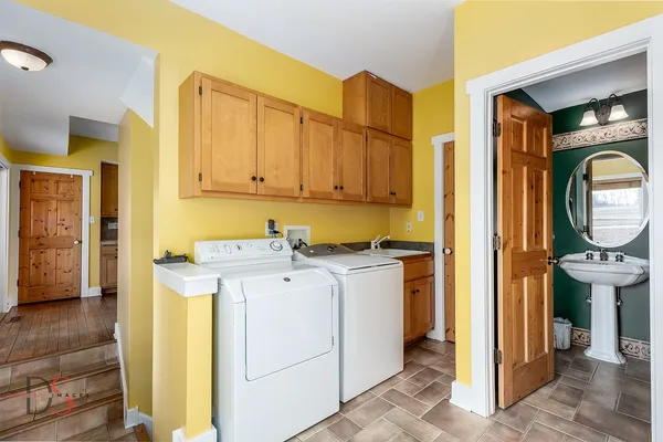 a view of a hallway with washer and dryer