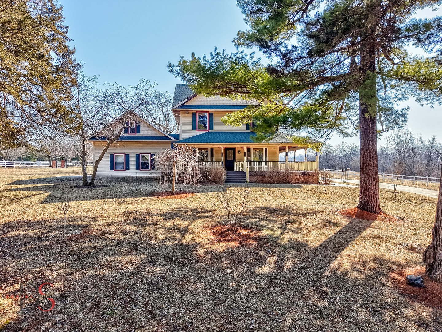 10978 A Crimmin Road Newark, IL 60541 - Photo 4 of 24 a front view of a house with a yard tree and wooden fence