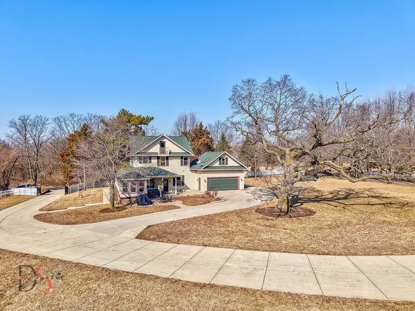 a view of a house with snow on the ground