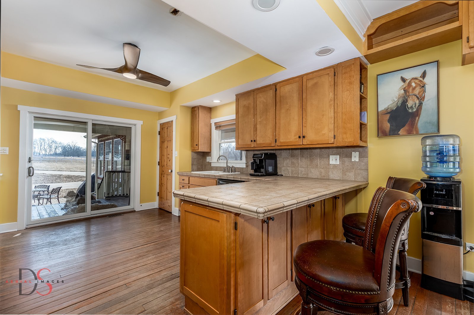 10978 A Crimmin Road Newark, IL 60541 - Photo 10 of 24 a view of a kitchen with kitchen island granite countertop wooden floor and a window