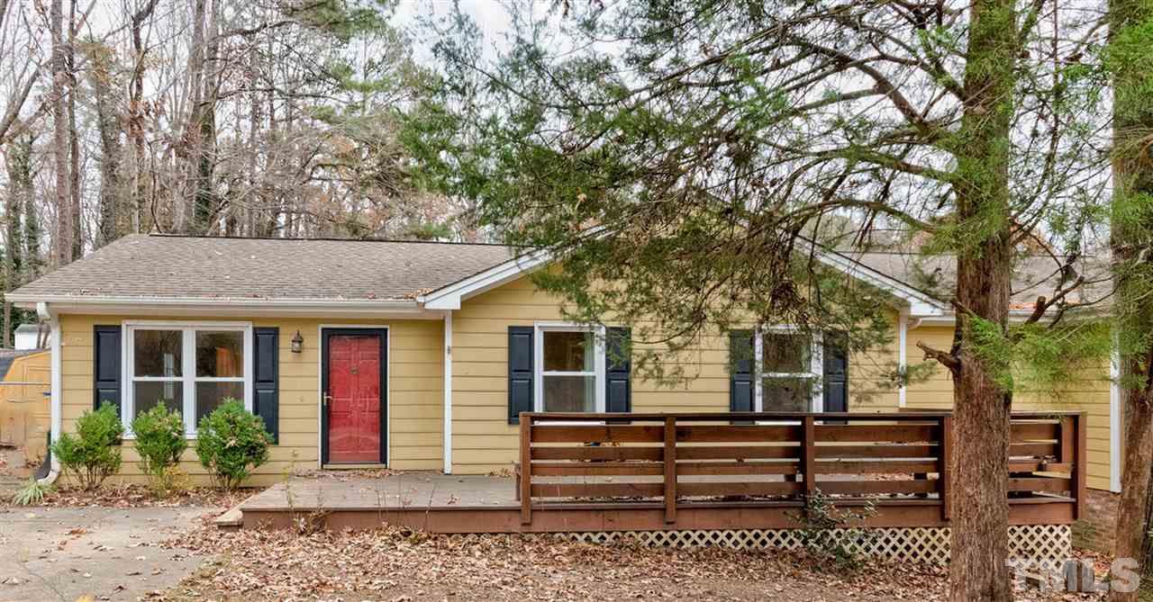 7300 Post Oak Road Raleigh, NC 27615 - Photo 1 of 30 a front view of a house with a garden