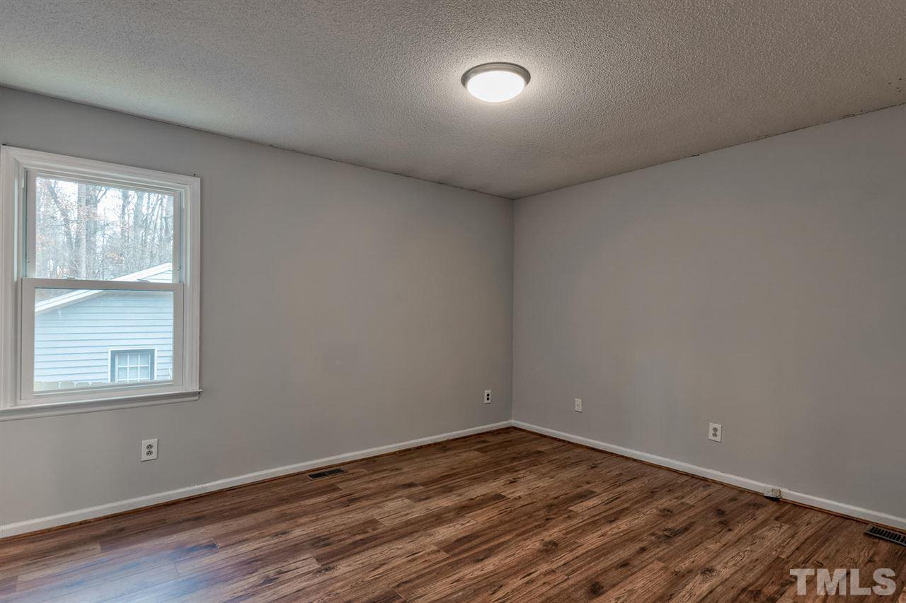 7300 Post Oak Road Raleigh, NC 27615 - Photo 13 of 30 an empty room with a window