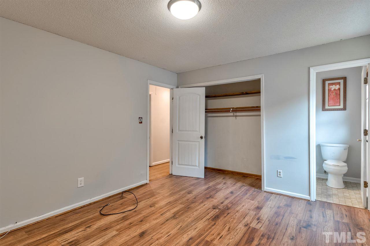 7300 Post Oak Road Raleigh, NC 27615 - Photo 14 of 30 a view of an empty room with wooden floor and a window