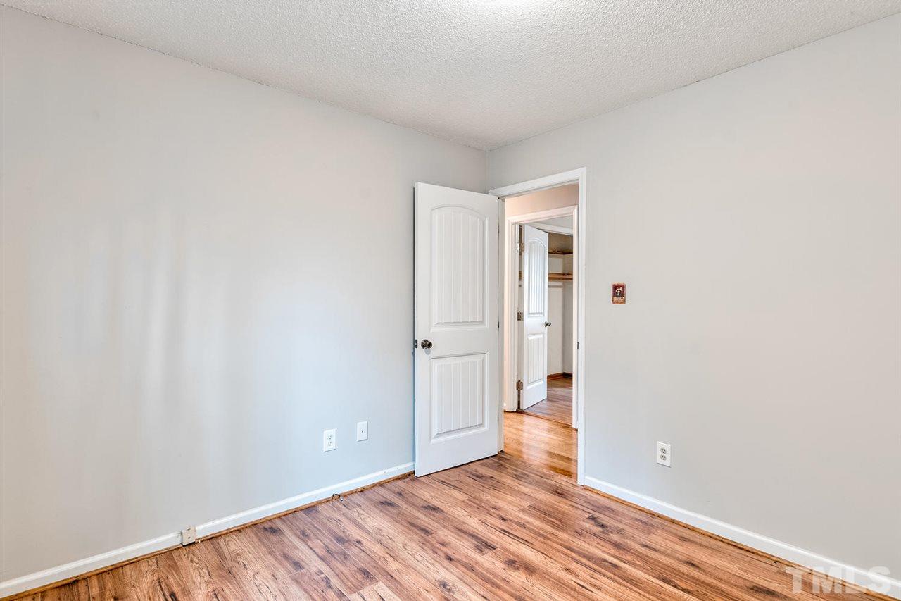 7300 Post Oak Road Raleigh, NC 27615 - Photo 18 of 30 a view of an empty room with wooden floor