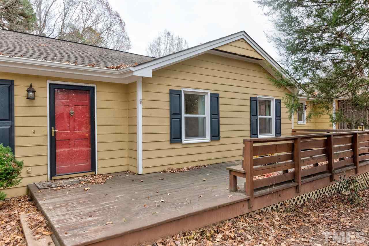 7300 Post Oak Road Raleigh, NC 27615 - Photo 20 of 30 a front view of a house with a garage