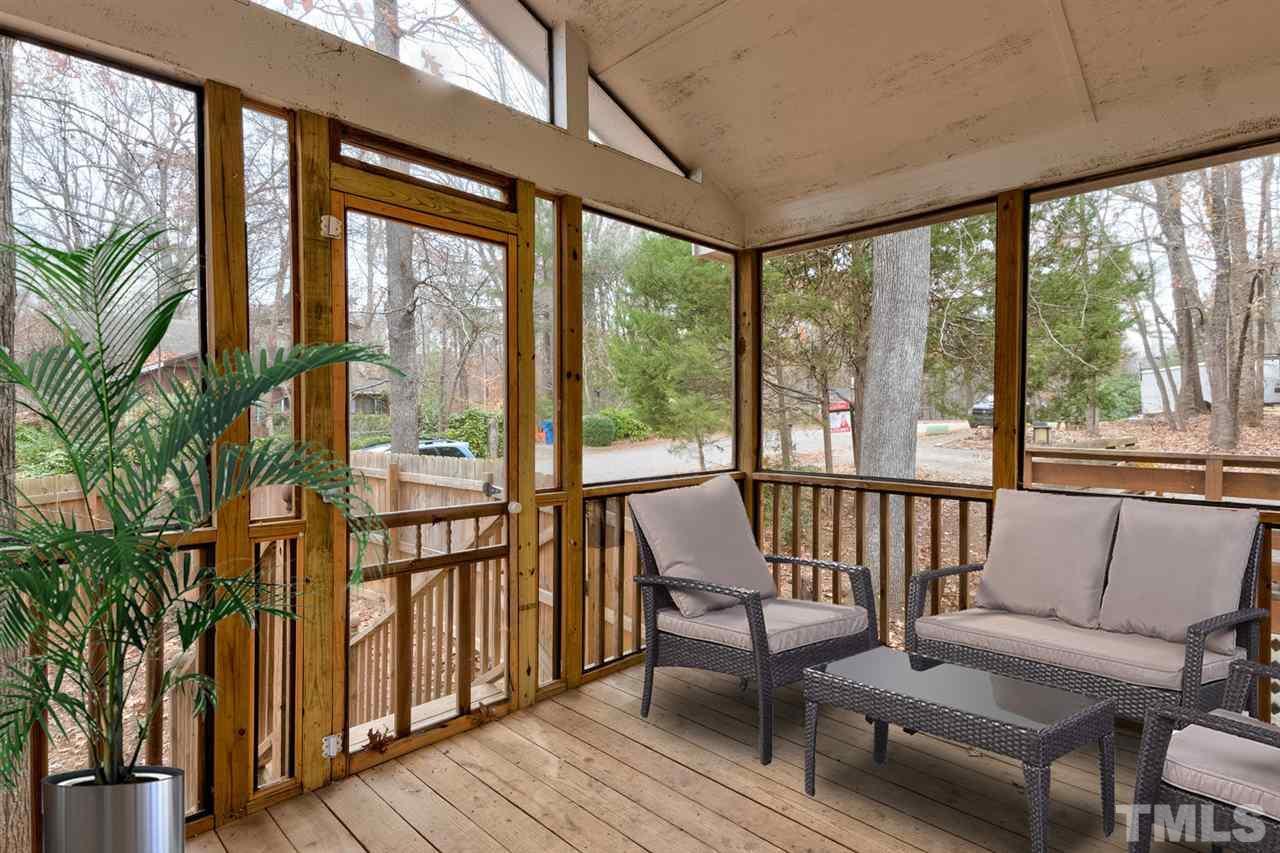 7300 Post Oak Road Raleigh, NC 27615 - Photo 22 of 30 a view of a porch with furniture and wooden floor