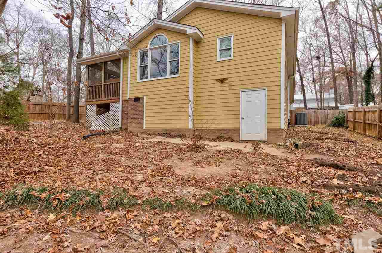 7300 Post Oak Road Raleigh, NC 27615 - Photo 25 of 30 a view of a house with a yard