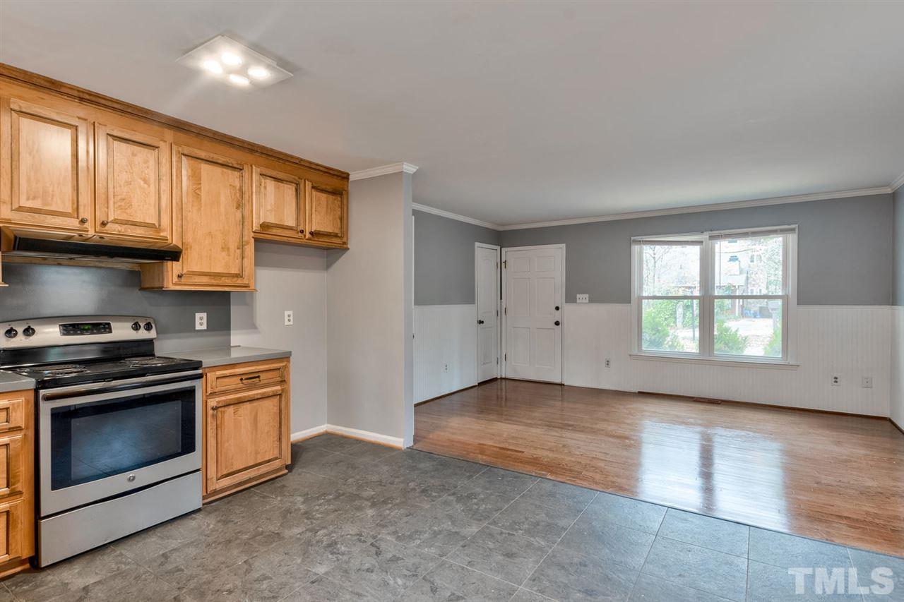 7300 Post Oak Road Raleigh, NC 27615 - Photo 6 of 30 a view of a kitchen with a stove cabinets and a window