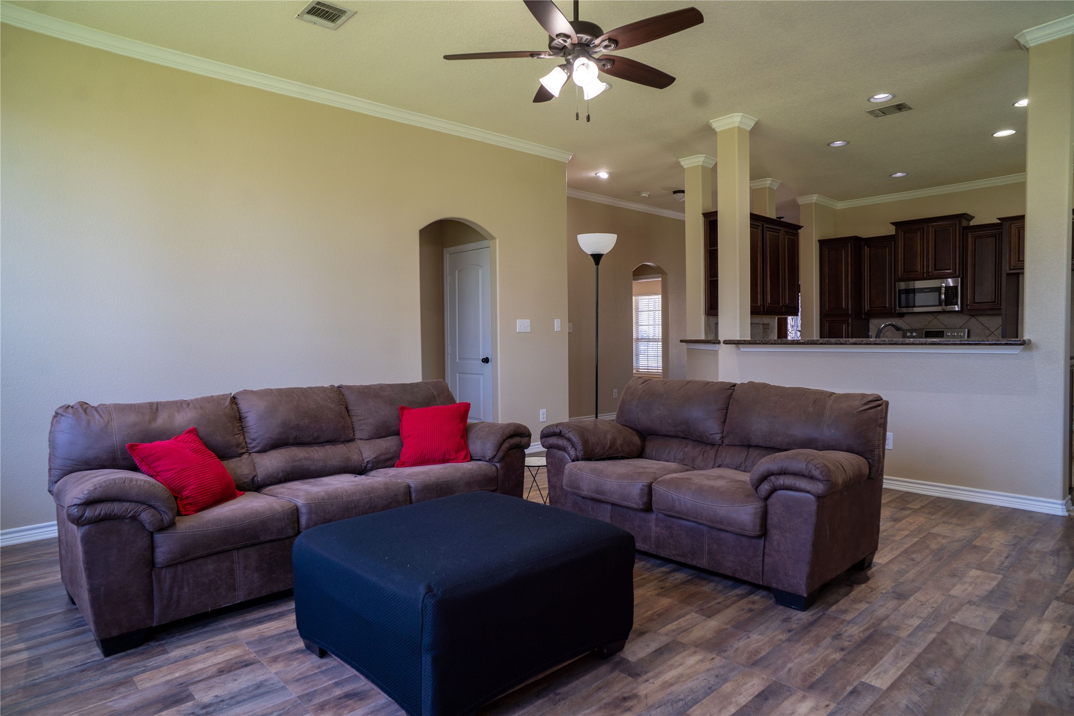 119 Hackberry Street Louise, TX 77455 - Photo 14 of 31 a living room with furniture and a wooden floor