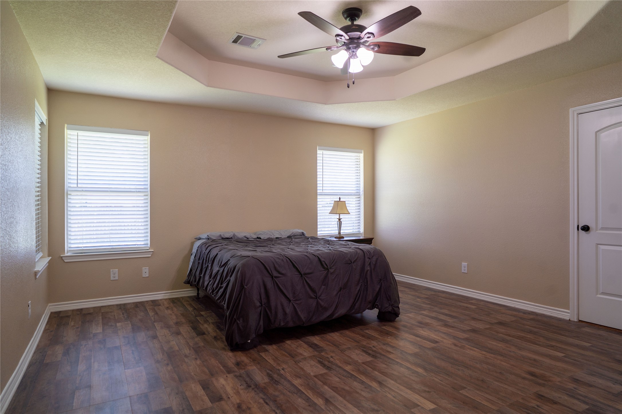 119 Hackberry Street Louise, TX 77455 - Photo 18 of 31 a spacious bedroom with a bed and a window
