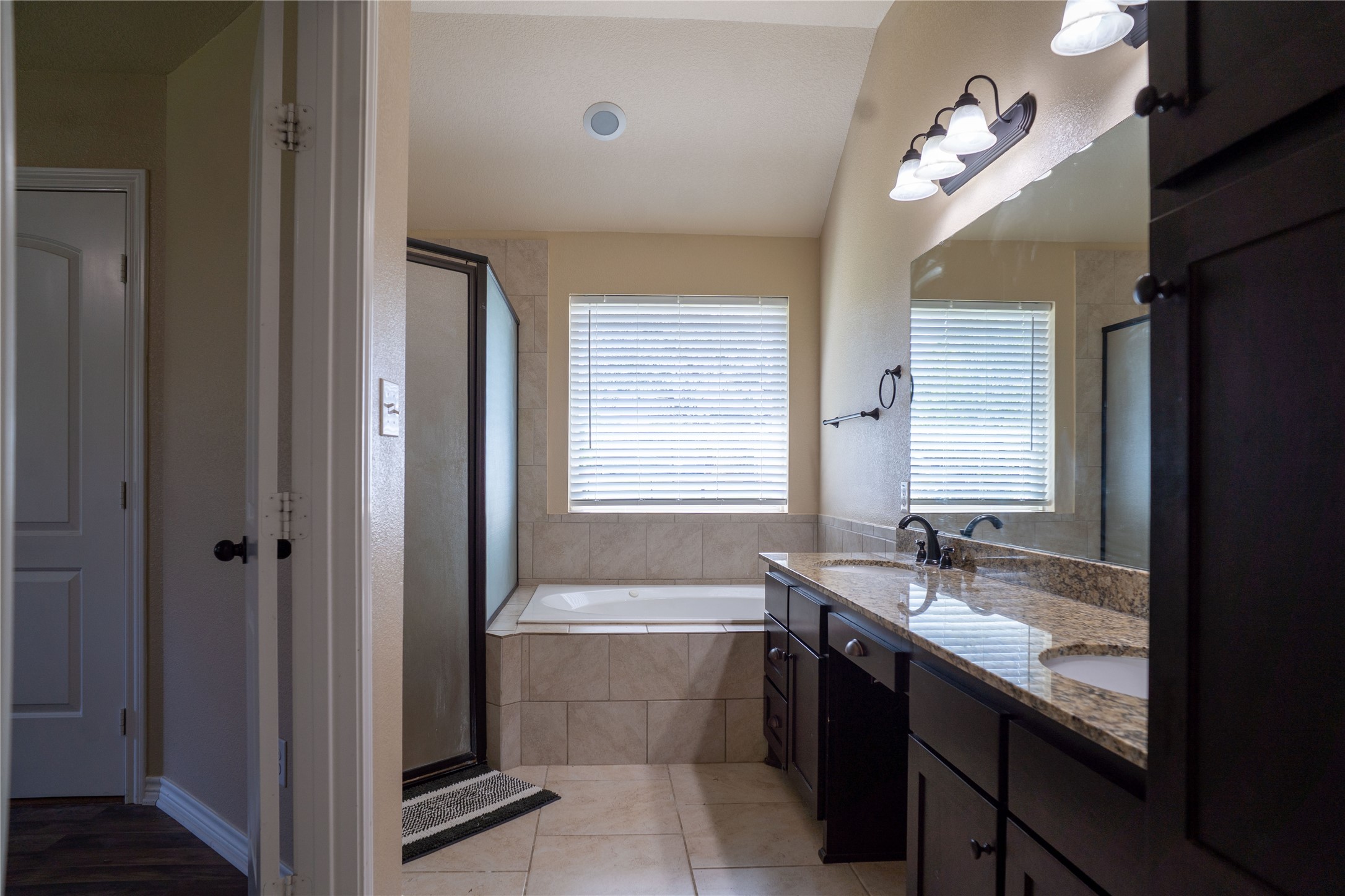 119 Hackberry Street Louise, TX 77455 - Photo 19 of 31 a bathroom with a tub sink and mirror