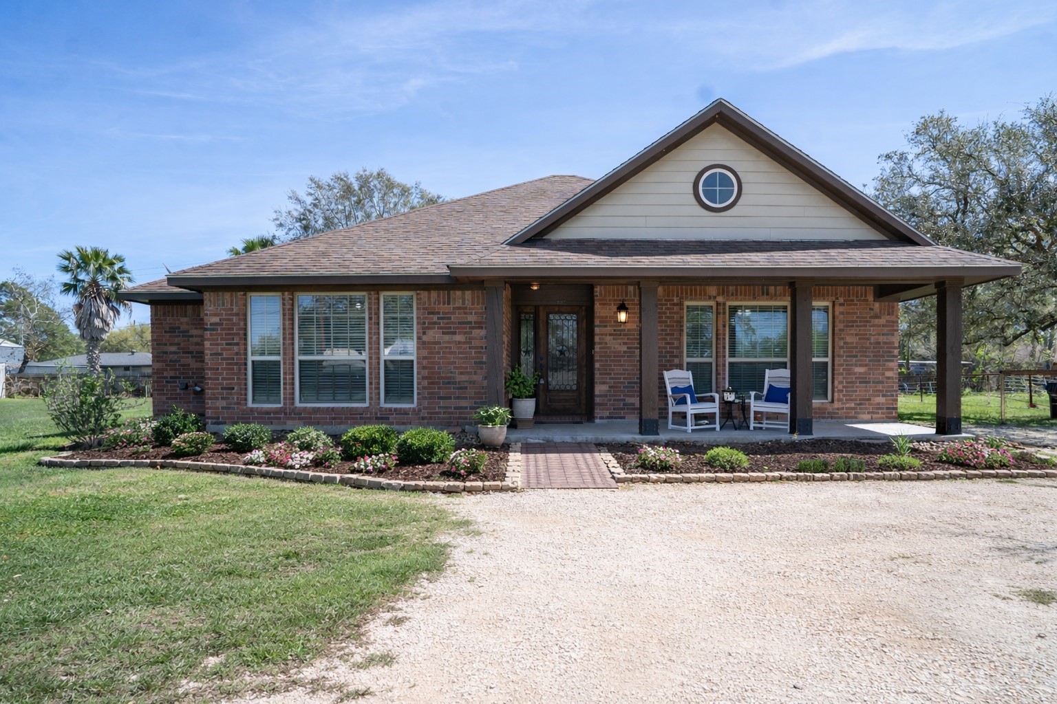 119 Hackberry Street Louise, TX 77455 - Photo 2 of 31 a front view of a house with a yard