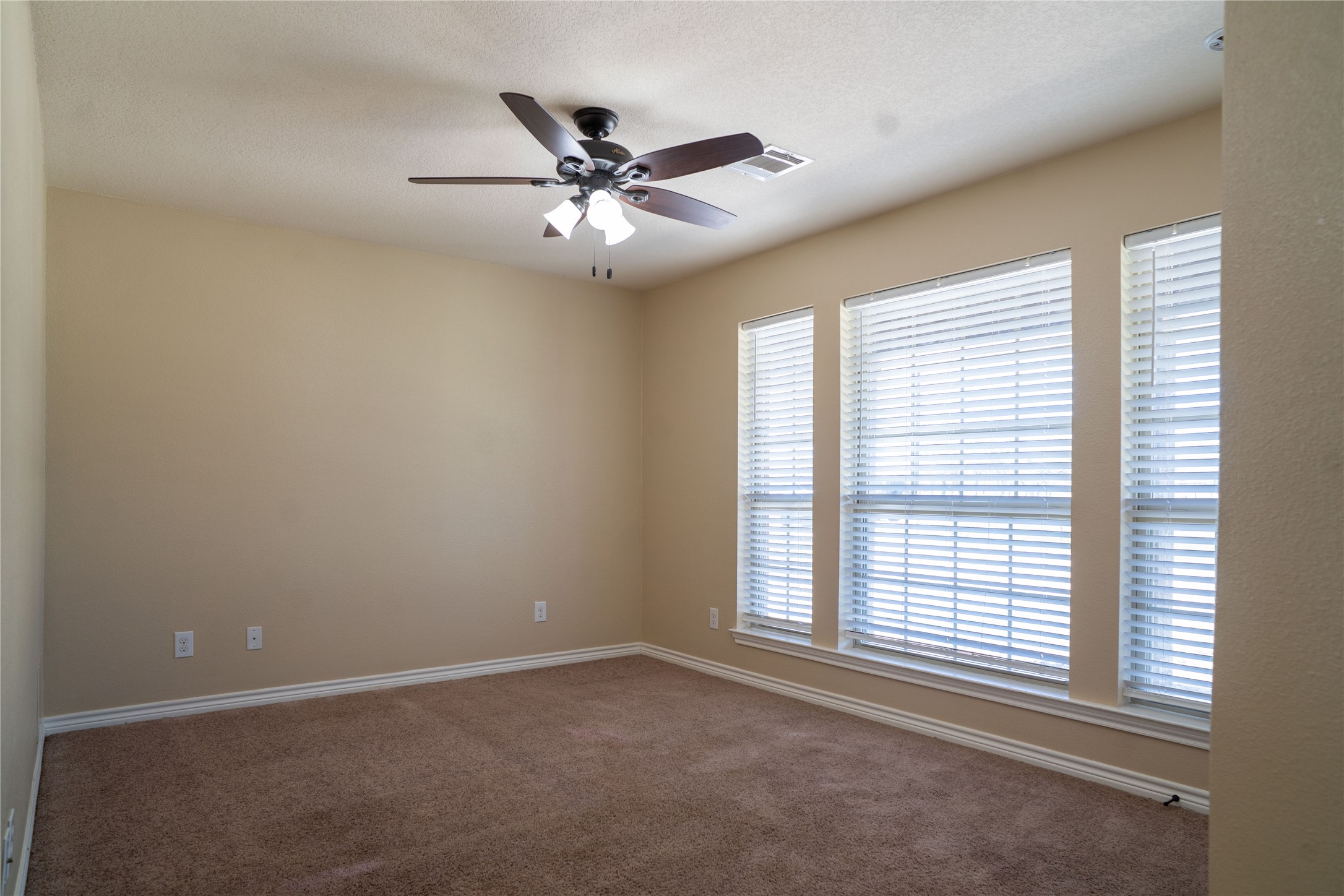 119 Hackberry Street Louise, TX 77455 - Photo 22 of 31 a view of a livingroom with a ceiling fan and window